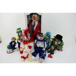 Clowns - A collection of clown dolls to include: a large boxed porcelain clown from the Leonardo