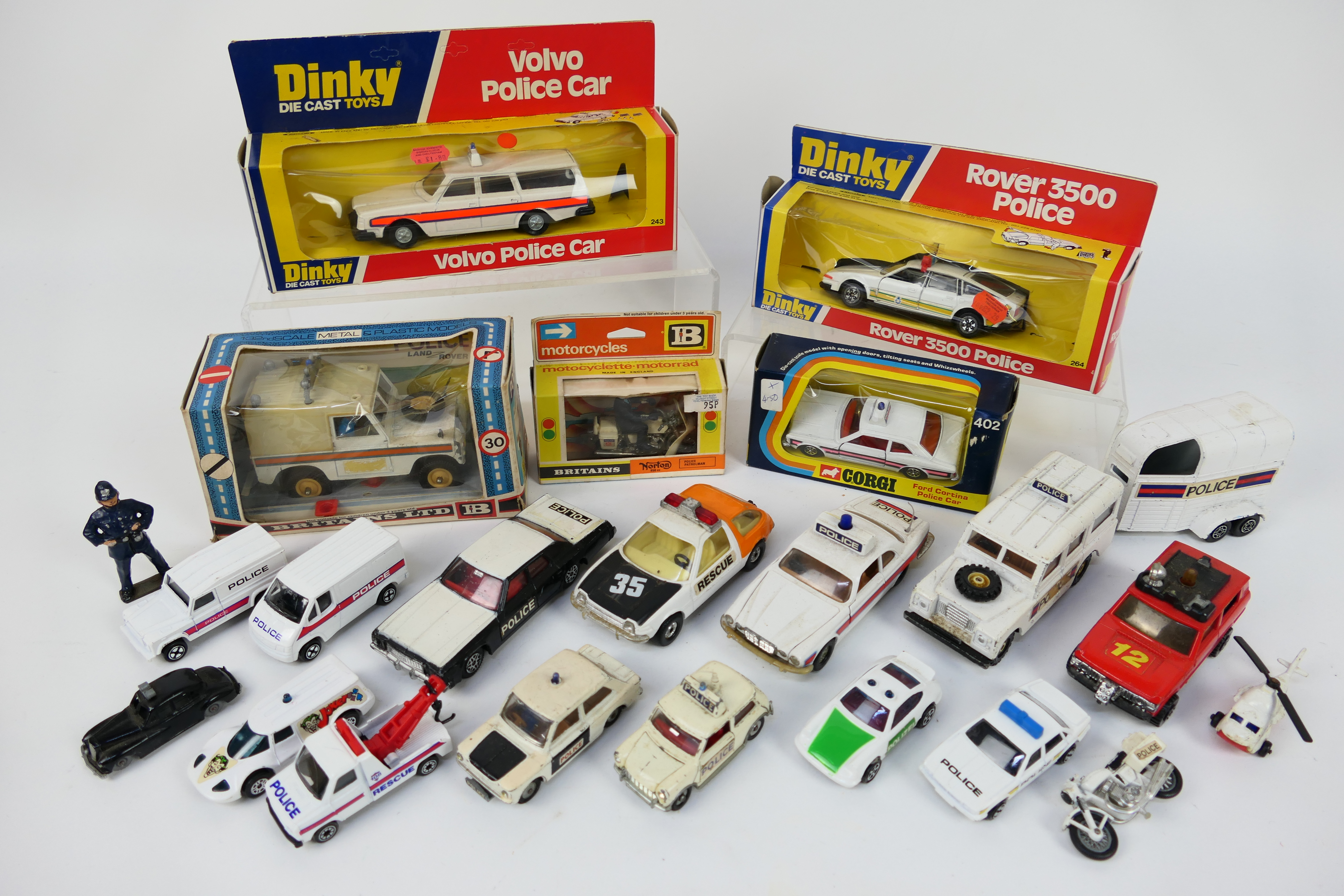 Corgi - Britains - Dinky - Matchbox - Others - Five boxed diecast Police vehicles with a group of