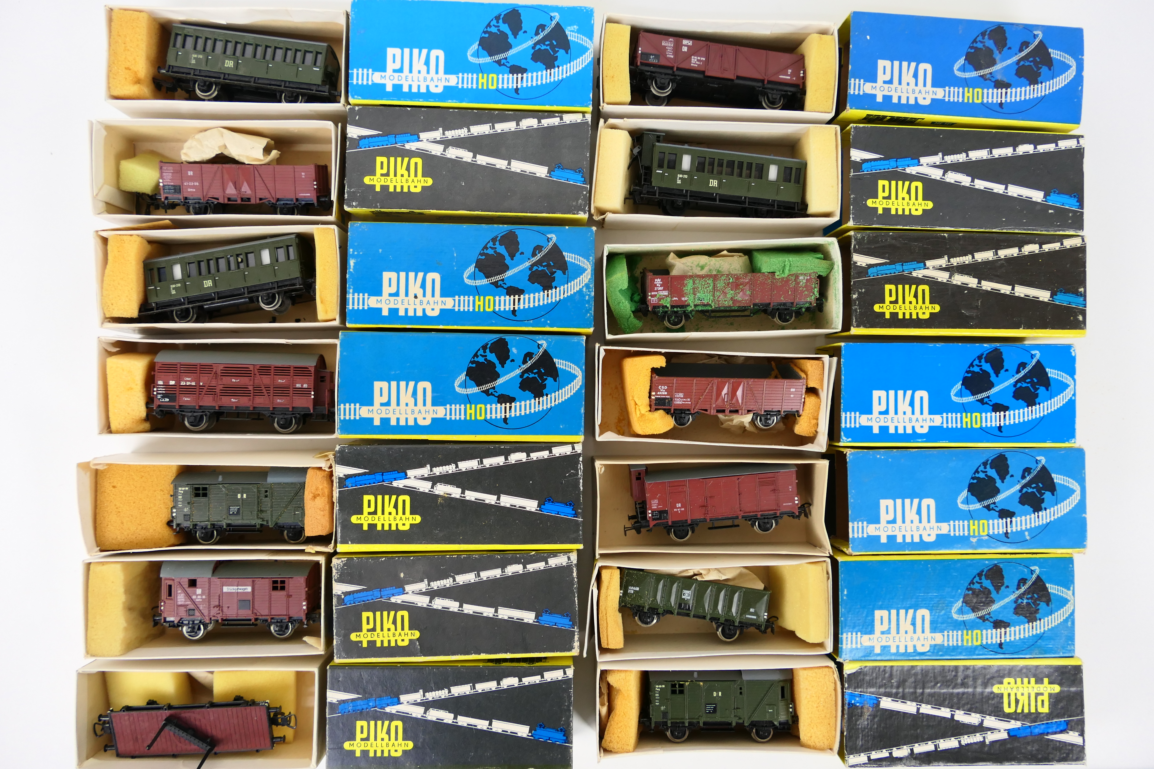 Piko - A boxed rake of 14 items of HO gauge passenger and freight rolling stock.