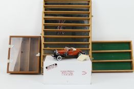 Danbury Mint - A Limited Edition 1:24 scale diecast model car with a small group of wooden display