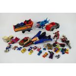Hasbro - Takara - An unboxed collection of Transformer action figures.