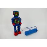 Yoshiya - KO - An unboxed vintage battery powered tinplate High Wheel Robot made in Japan by