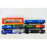 Hornby - A boxed OO gauge Macaw bogie bolster wagon # R6123A and 5 x unboxed container wagons #