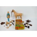 Marx - A boxed Jane West Cowgirl figure with accessories and an unboxed horse.