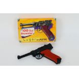 Lone Star - A boxed vintage diecast Lone Star 100 shot repeater 'Luger' cap pistol.