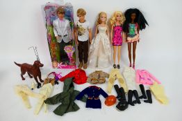 Mattel - Barbie - Ken - A boxed Ken doll with 4 x unboxed dolls and a collection of clothing and