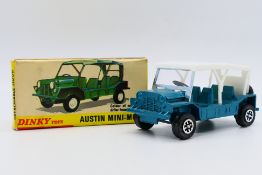 Dinky - A boxed late model Austin Mini-Moke in metallic green with Speedwheels # 342.