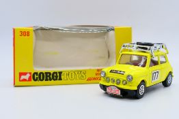 Corgi - A boxed Monte-Carlo Mini Cooper S with whizzwheels in yellow racing number 177 # 308.