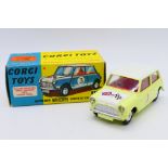 Corgi - A boxed Morris Mini Cooper Competition model in Primrose yellow with a white bonnet and