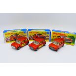 Matchbox - 3 x boxed Racing Mini models in metallic orange,