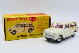 Dinky - A boxed Morris MIni Traveller in cream with red interior # 197.