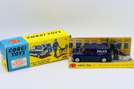 Corgi - A boxed B.M.C. Mini Police van with Policeman and tracker dog # 448.