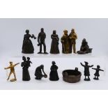 A collection of bronze figures to include Victorian style ladies, gentlemen, servants,