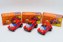 Matchbox - 3 x boxed Mini Ha-Ha models in red with differences in the flesh colour of the driver #