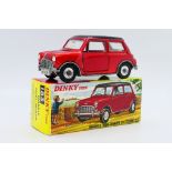 Dinky - A boxed Morris Mini Minor Automatic in metallic red with gloss black roof # 183.