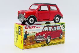 Dinky - A boxed Morris Mini Minor Automatic in metallic red with gloss black roof # 183.