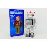 A boxed Chinese made tinplate robot 'Space Walk Man'.