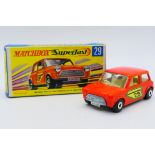 Matchbox - A boxed Racing Mini in orange with the rare green edged number stickers.