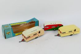 Spot-On - A boxed Spot-On #264 diecast Tourist Caravan, with two repainted variants.