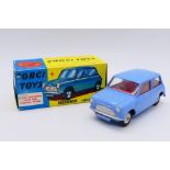 Corgi - A boxed Morris Mini Minor in blue with red interior and shaped wheel hubs # 226.