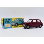 Corgi - A boxed Corgi Morris Mini Minor in metallic red # 226.