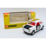 Corgi - A boxed Mini Cooper with whizzwheels in white and black with racing number 177 # 282.