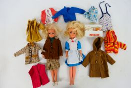 Pedigree - Sindy - 2 x vintage Sindy walker dolls with additional clothing.