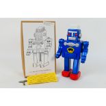 Hawkin's Bazaar Tin Toys Collectors' Club - A boxed Chinese made tin plate robot in blue colour.