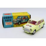Corgi - A boxed Morris Mini Cooper Competition model in Primrose yellow with a white bonnet and