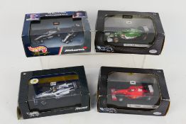 Hot Wheels - 4 x boxed Hot Wheels 1:43 and 1:64 die-cast race cars - Lot includes a 1:43 #50205