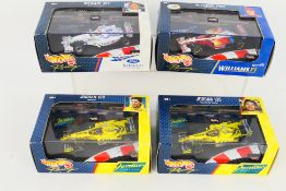 Hot Wheels - 4 x boxed Hot Wheels 1:43 die-cast race cars - Lot includes a #24625 Williams FW21