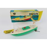 Sutcliffe Models - A Sutcliffe Models 'Hawk' tinplate clockwork speedboat with green hull,
