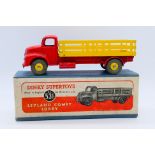 Dinky - A boxed Leyland Comet Lorry in red with yellow wheels and back # 531.