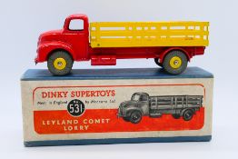 Dinky - A boxed Leyland Comet Lorry in red with yellow wheels and back # 531.