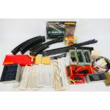 Hornby - A quantity of OO gauge track and trackside accessories including 12 x unused track