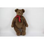 Boyds - A large Boyds bear with metal joints, plastic eyes, and stitched nose and mouth.