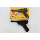 Lone Star - A boxed vintage diecast Lone Star 100 shot repeater 'Luger' cap pistol.