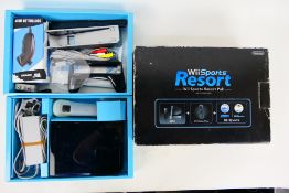 Nintendo - A boxed Nintendo Wii Sports Resort pack.