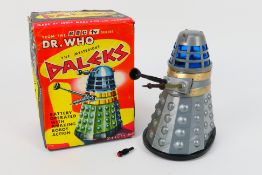 Marx - A boxed battery powered Dr. Who TV series Dalek by Marx dated 1964.