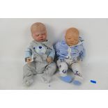 Unknown Maker - 2 x life like reborn style baby dolls with closed eyes.
