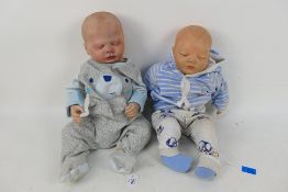 Unknown Maker - 2 x life like reborn style baby dolls with closed eyes.