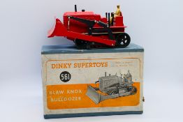 Dinky - A boxed Blaw Knox Bulldozer in red with green tracks # 561.