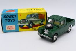 Corgi - A boxed Land Rover 109 Pickup in dark green # 438.
