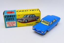 Corgi - A boxed Chevrolet Corvair sedan in mid blue # 229.
