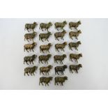 A collection of bronze figures to include Twenty-two Rams.
