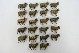 A collection of bronze figures to include Twenty-two Rams.