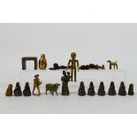 A collection of bronze figures to include Victorian style ladies, children, puppet, dogs,