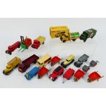 Dinky - A group of vehicles and accessories including a boxed Bedford refuse wagon # 252,