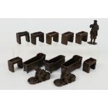 A collection of bronze figures to include Victorian style ladies, gentlemen, coffin bath, sink,