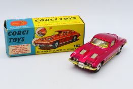 Corgi - A boxed Chevrolet Corvette Sting Ray Coupe in metallic red # 310.